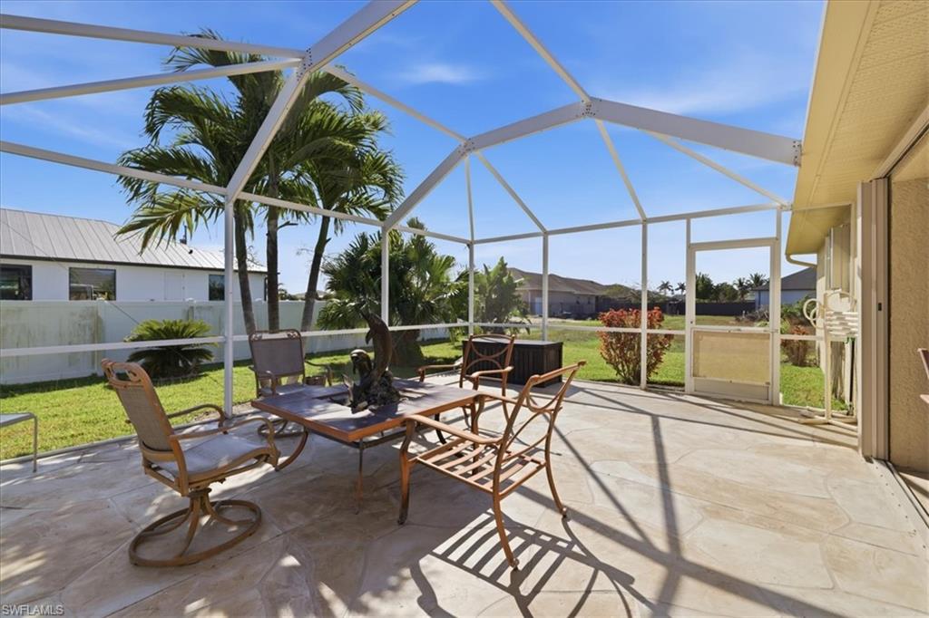 View of patio with a lanai and a sunroom