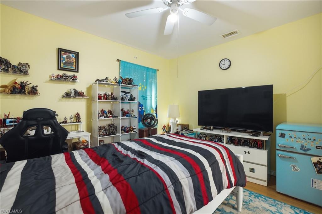 Bedroom featuring wood finished floors and a ceiling fan