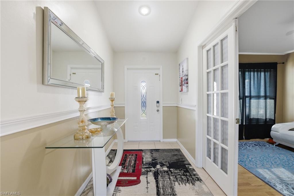 Foyer featuring light tile patterned floors