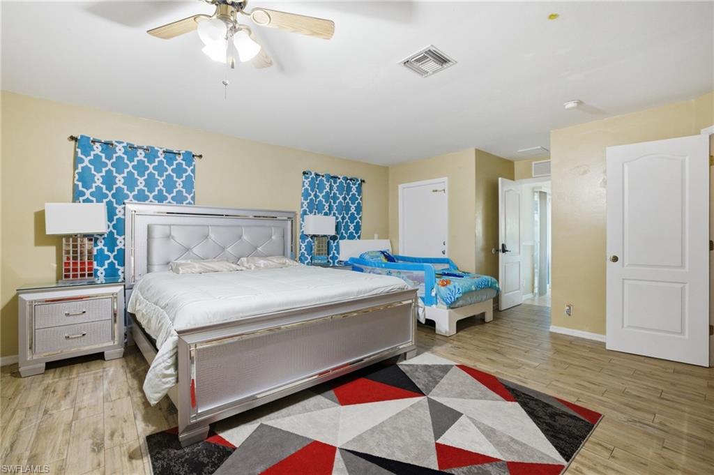 Bedroom featuring light wood-type flooring and ceiling fan