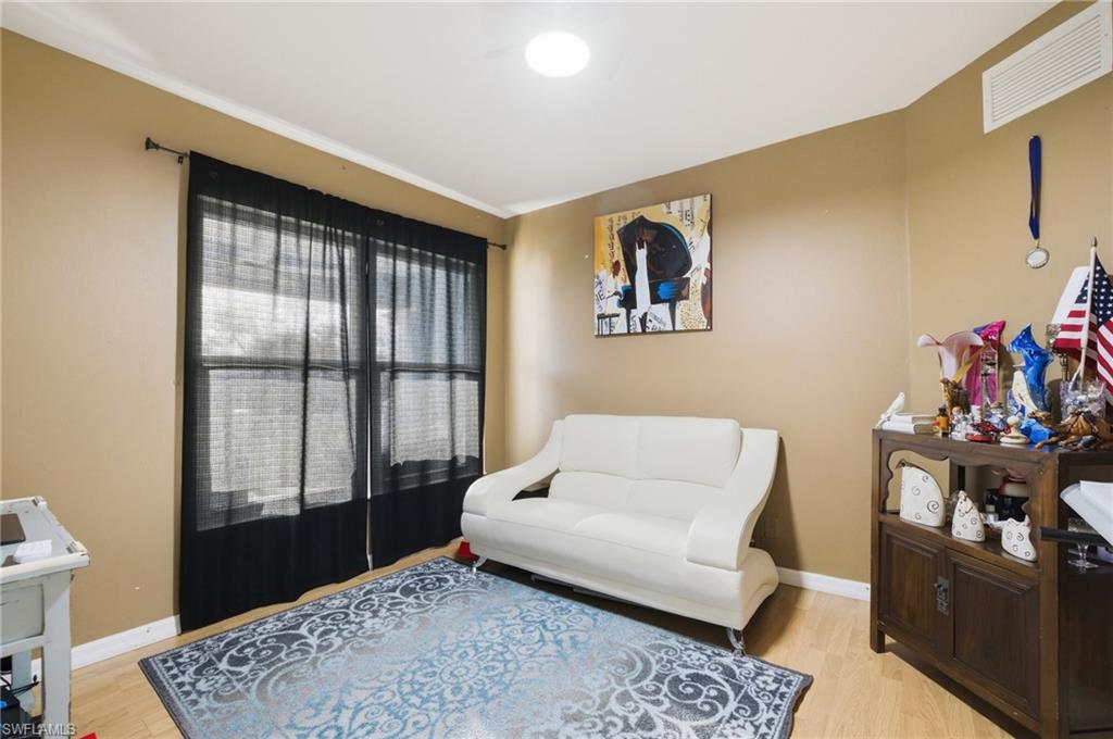 Living area with light wood-type flooring