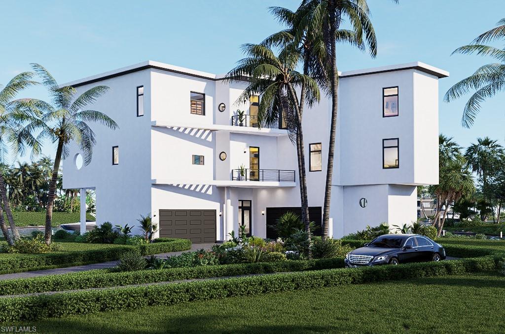 View of apartment building / complex featuring a garage