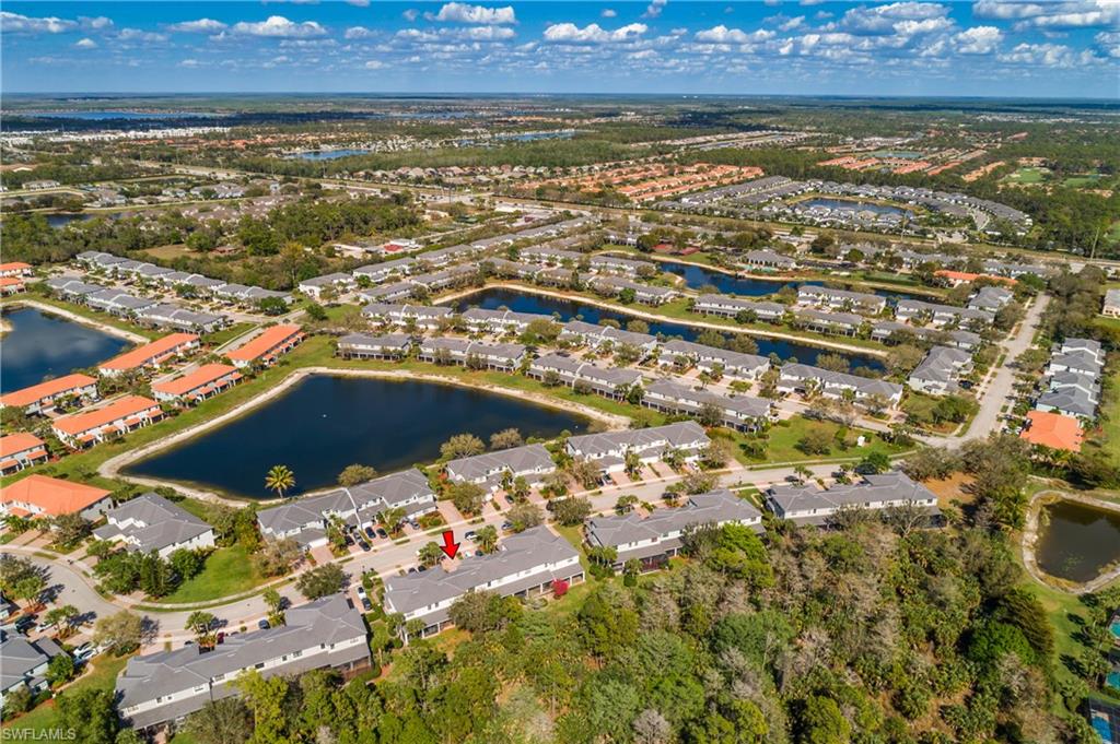 Aerial perspective of suburban area with a nearby body of water