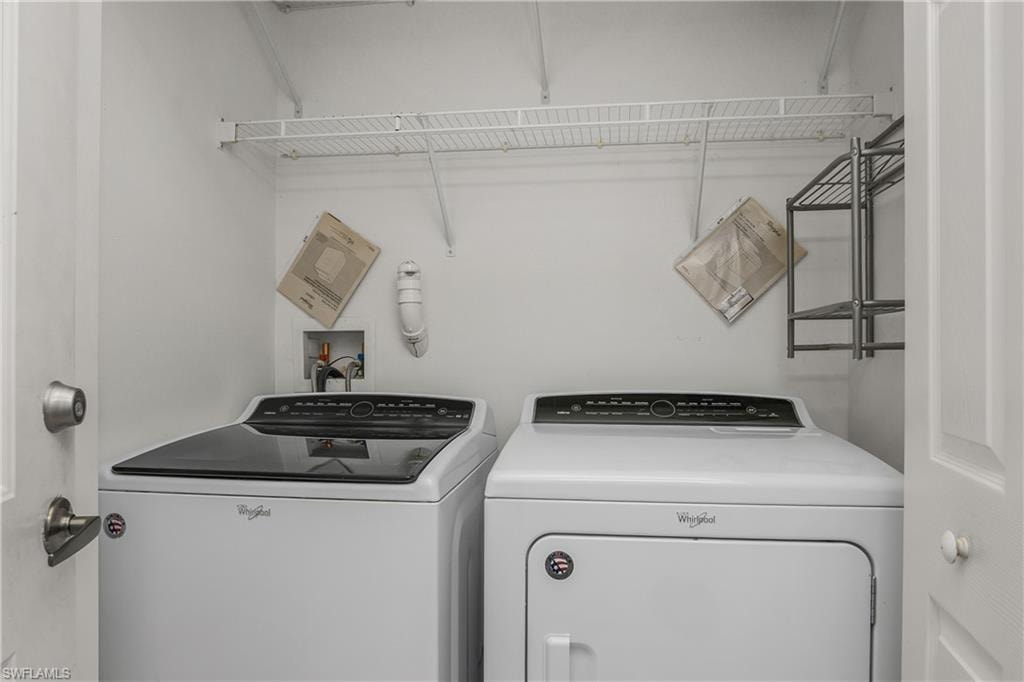 Laundry room featuring washing machine and clothes dryer