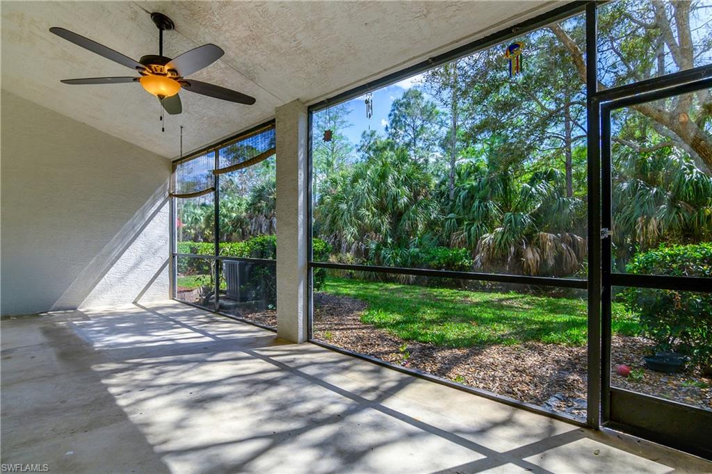 Unfurnished sunroom with ceiling fan