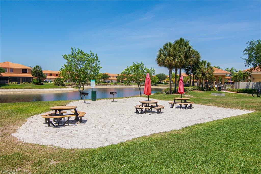 View of property's community featuring a water view and a patio