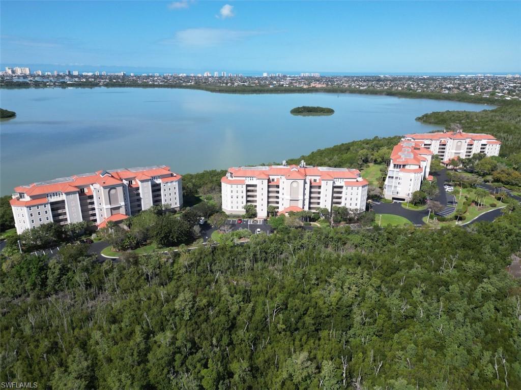 Bird's eye view of apartment complex / building and a nearby body of water