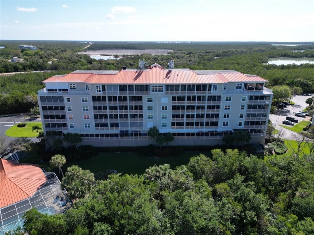 Aerial view of apartment complex / building and a large body of water