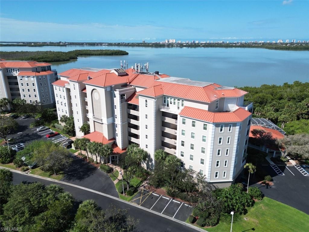 Aerial view of apartment complex and a large body of water