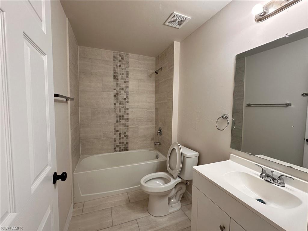 Full bath with vanity and bathtub / shower combination