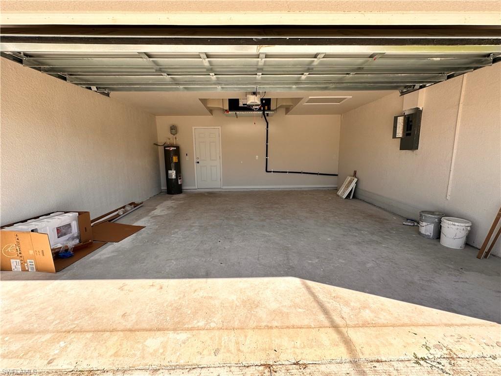 Garage with electric panel and electric water heater