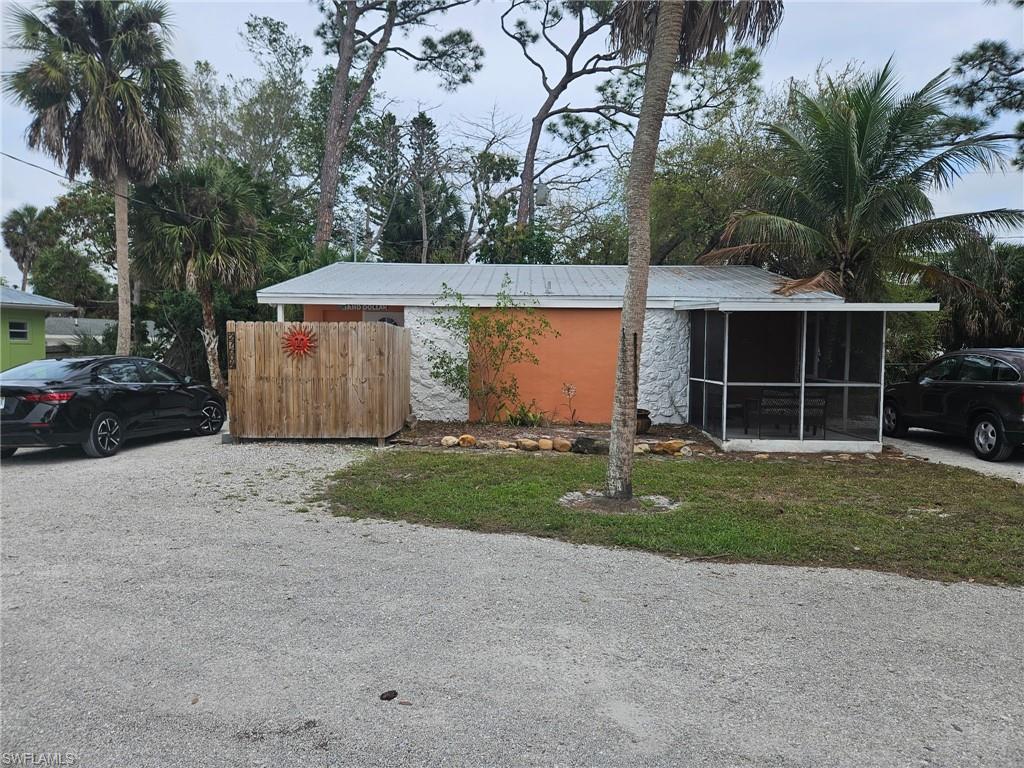 View of front of house with a sunroom