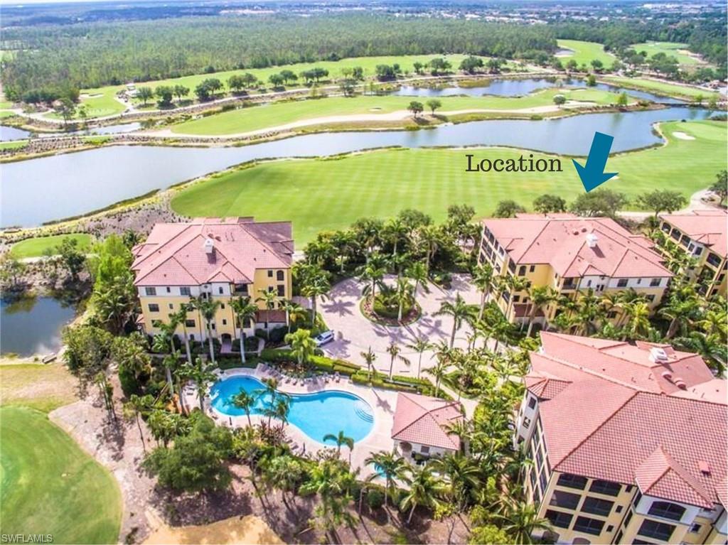Aerial view of a golf course and a nearby body of water
