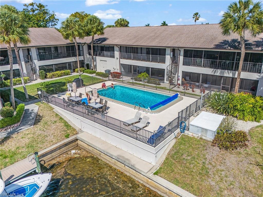 Community pool featuring a patio area and stairway