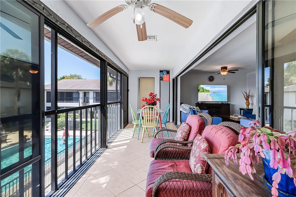 Sunroom featuring ceiling fan