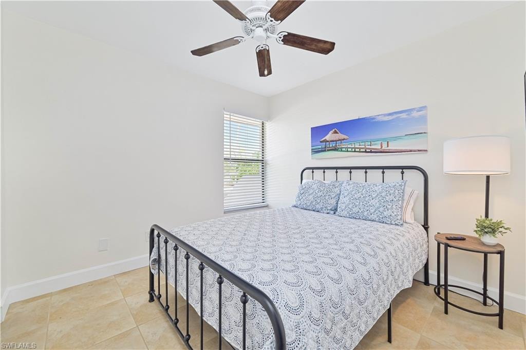Bedroom featuring a ceiling fan and light tile patterned floors