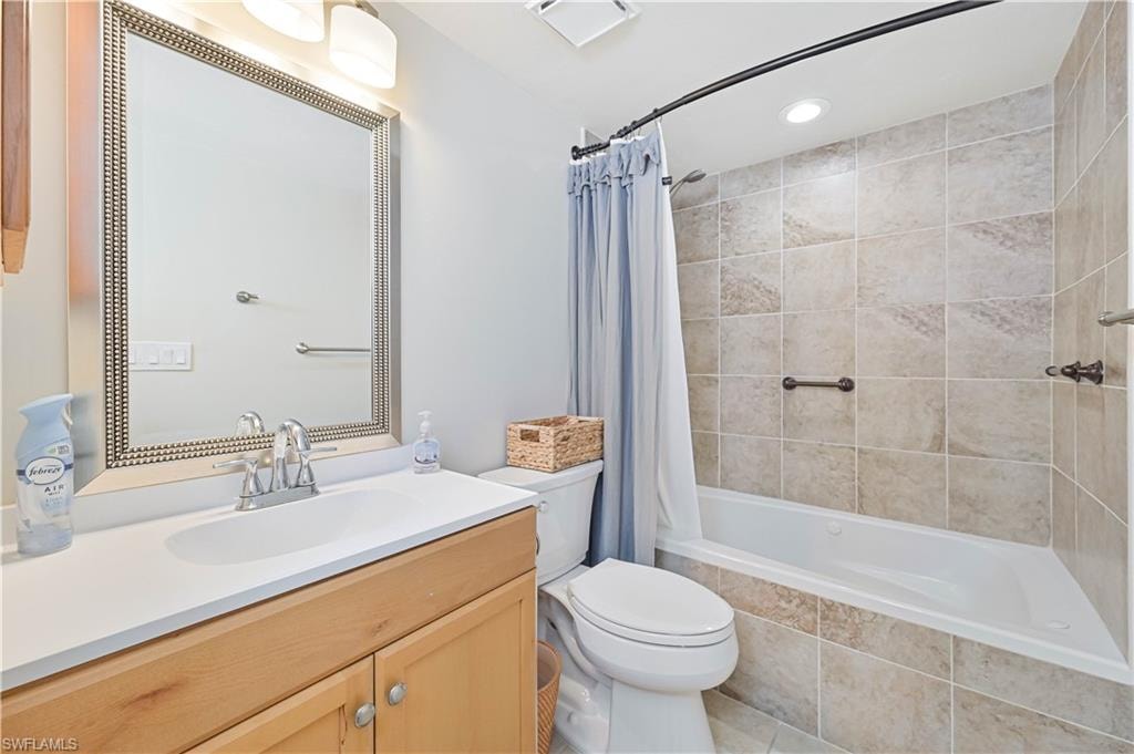 Full bathroom featuring vanity, recessed lighting, tiled shower / bath, and light tile patterned floors