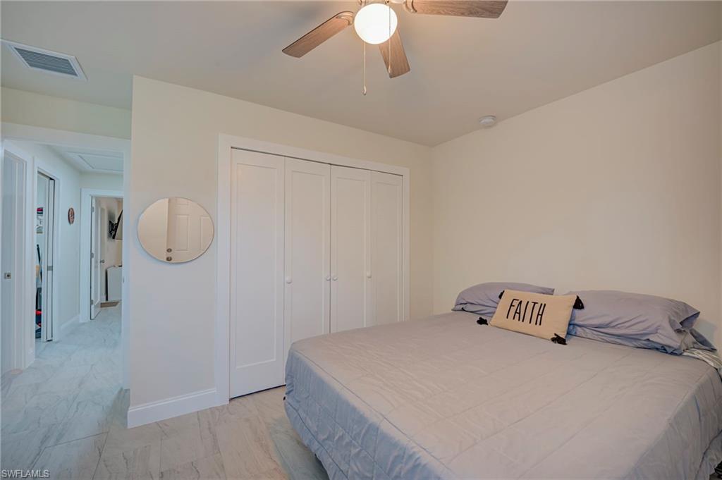 Bedroom with a closet and a ceiling fan