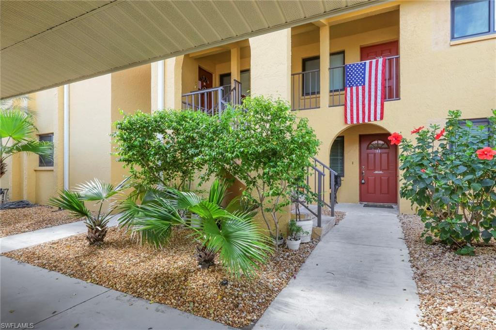 Entrance to property with stucco siding