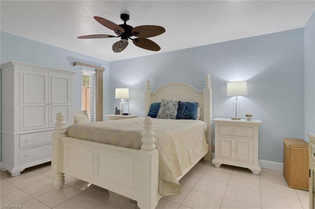 Bedroom featuring ceiling fan and light tile patterned flooring