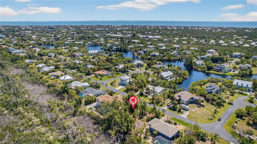 Aerial view of residential area with a large body of water