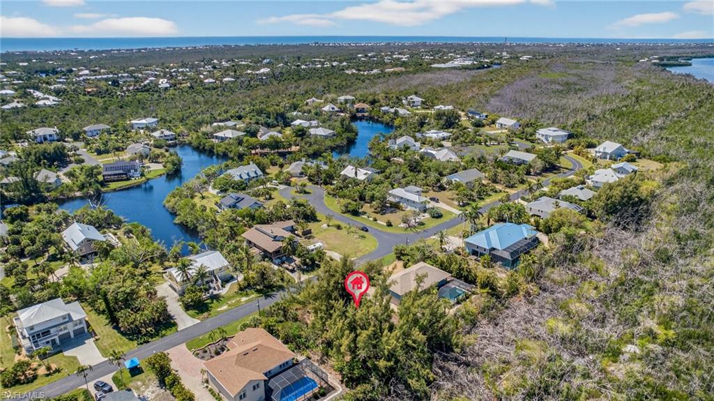 Aerial perspective of suburban area with a large body of water