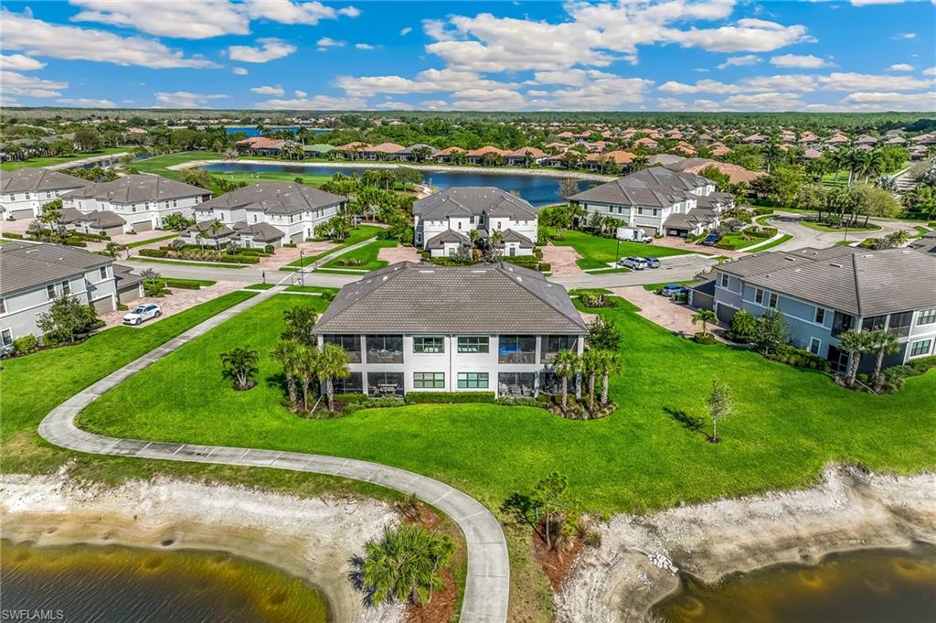 Aerial view of residential area with a large body of water