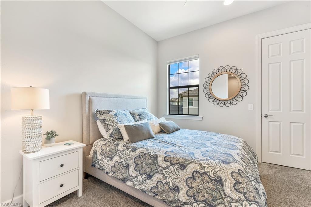 Bedroom with light carpet