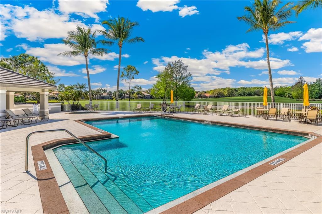 Community pool featuring a patio