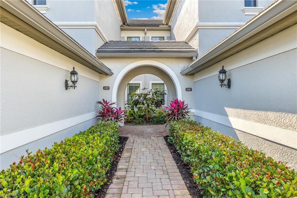 Entrance to property with stucco siding