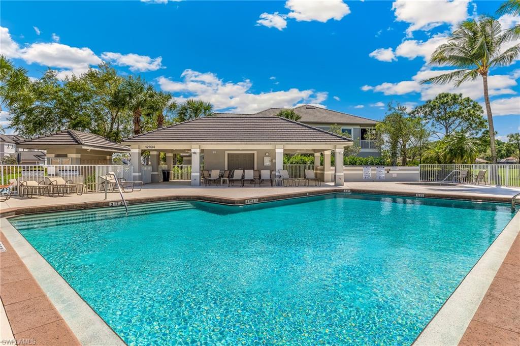Community pool with a patio