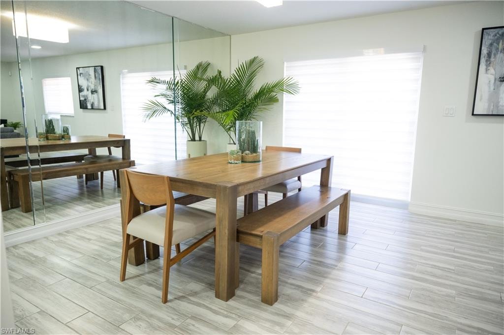 Dining room with wood finish floors and baseboards