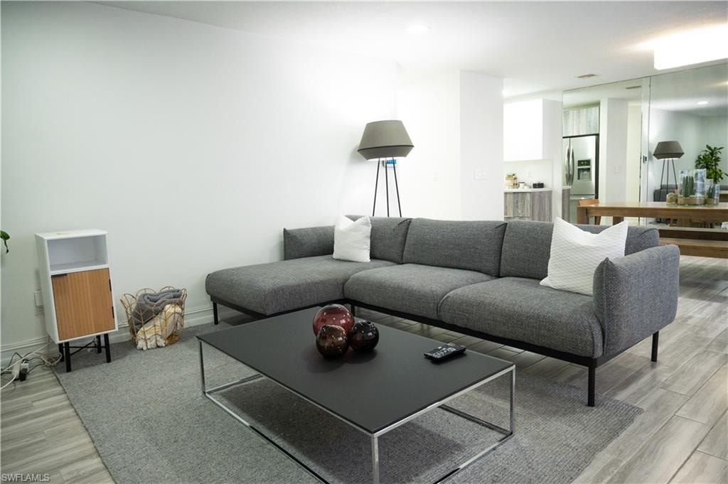 Living area with light wood-style floors