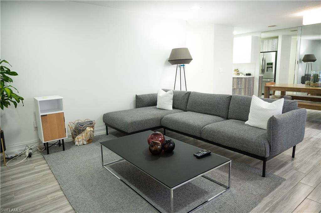 Living area with light wood-style flooring