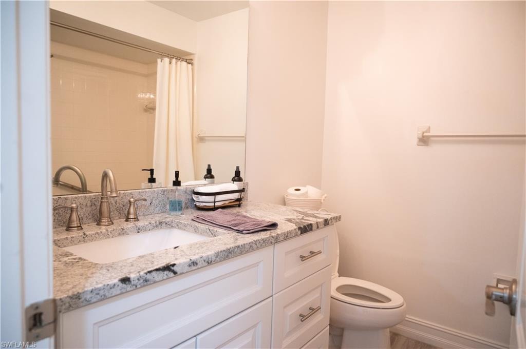 Bathroom featuring vanity and a shower with shower curtain