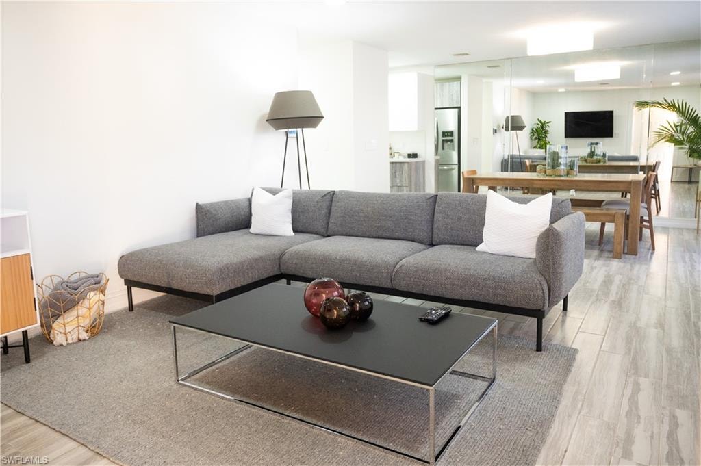 Living area with light wood finished floors