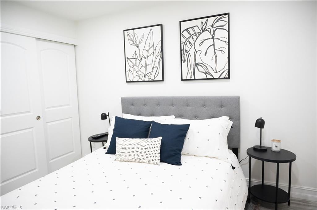 Bedroom featuring a closet and baseboards