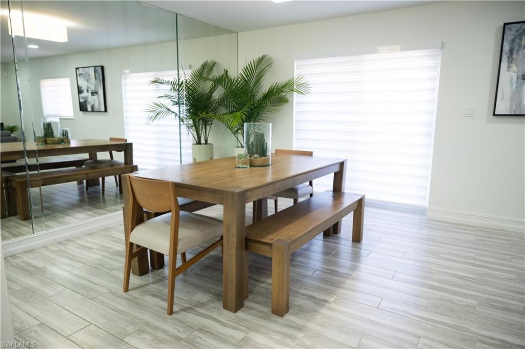 Dining space featuring wood finish floors and baseboards