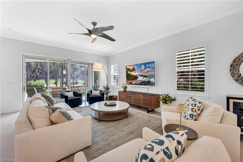 Open living room and view of golf course