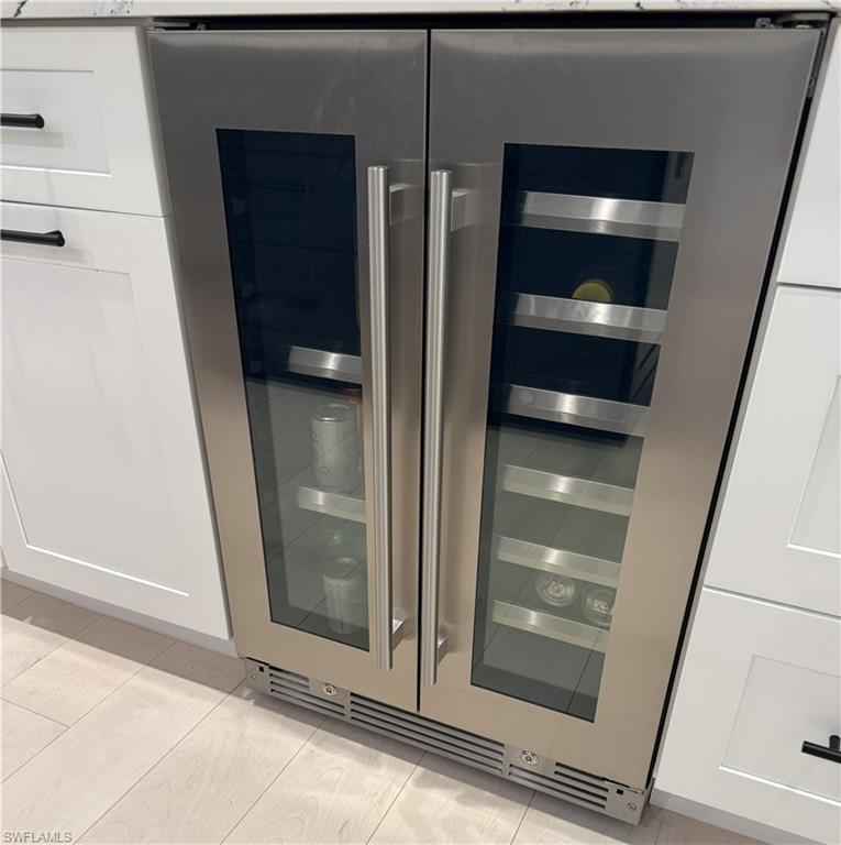 Wine cooler and white cabinetry