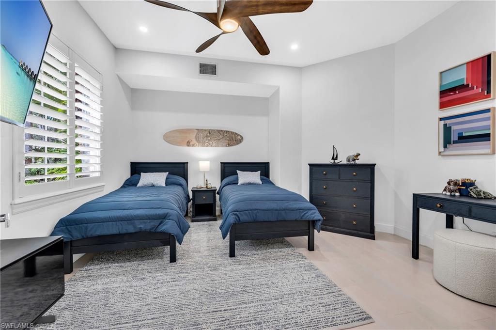 Den or additional guest quarters, with plantation shutters and French doors