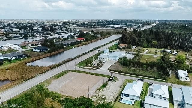 Aerial perspective of suburban area with a large body of water