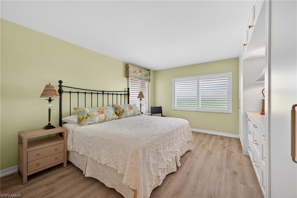 Primary bedroom with beach view.