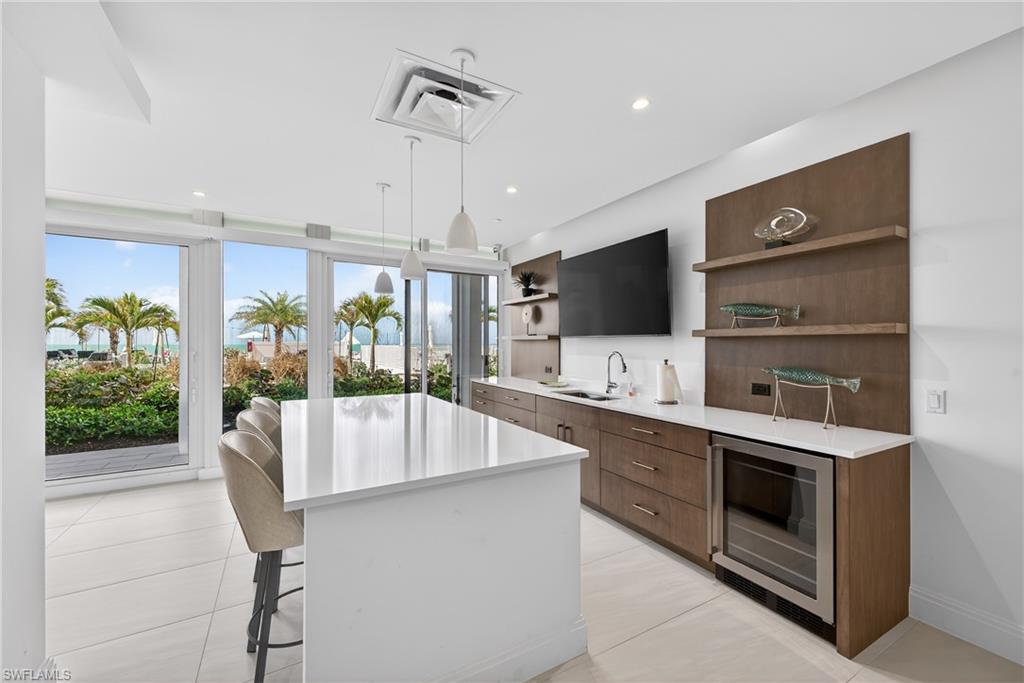 Community room with full Kitchen and views of pool area and beach.