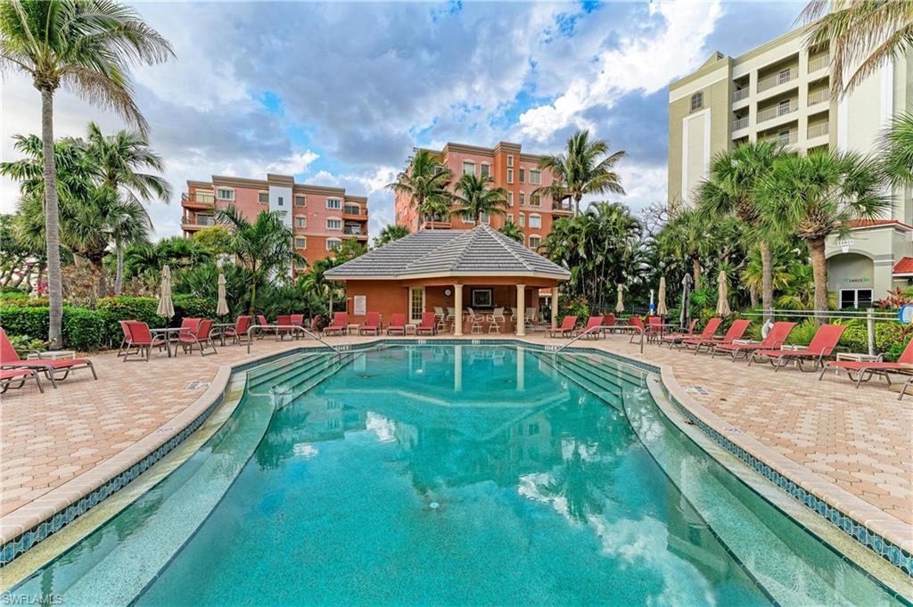 Community pool with a patio area