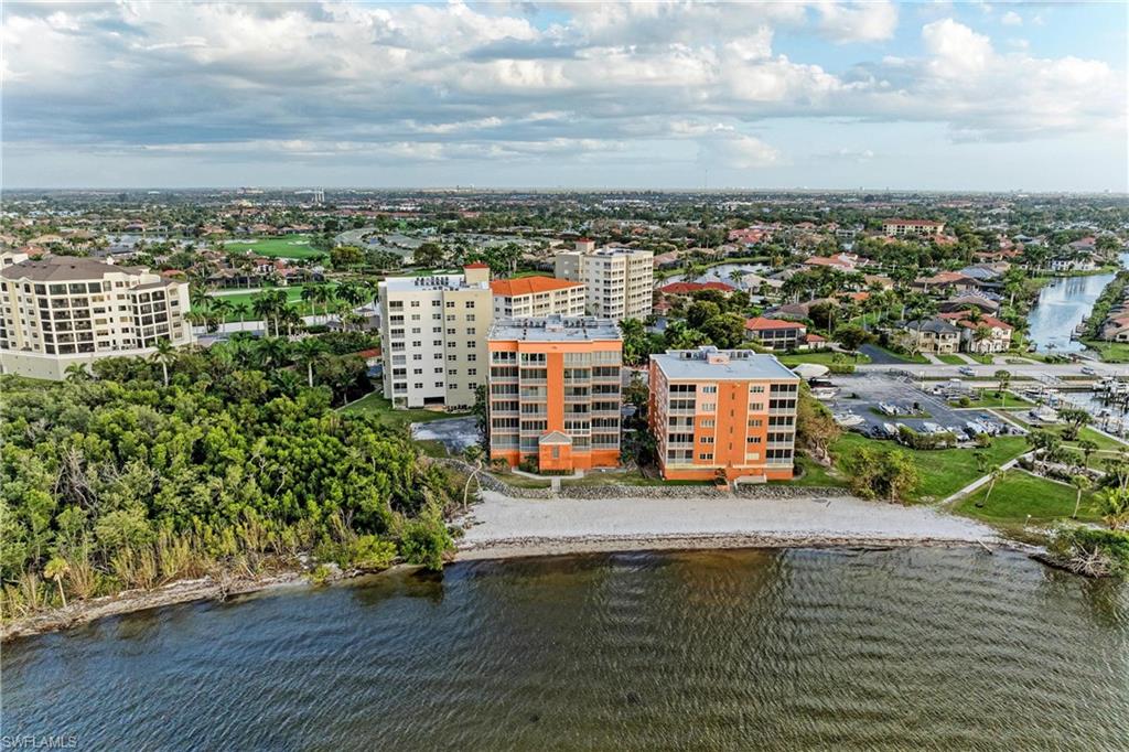 Aerial view of a nearby body of water and apartment complex