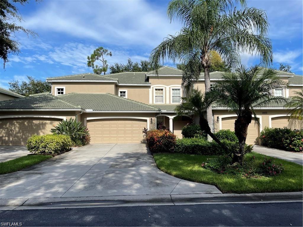 Mediterranean / spanish home with stucco siding, a garage, concrete driveway, and a tile roof