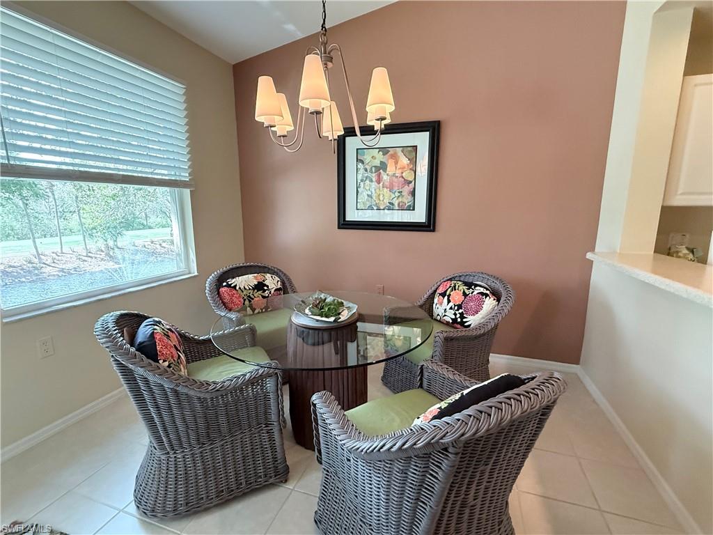 Dining space with a chandelier and light tile patterned floors