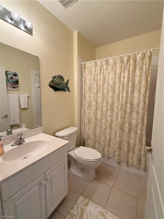 Full bathroom featuring vanity and light tile patterned flooring