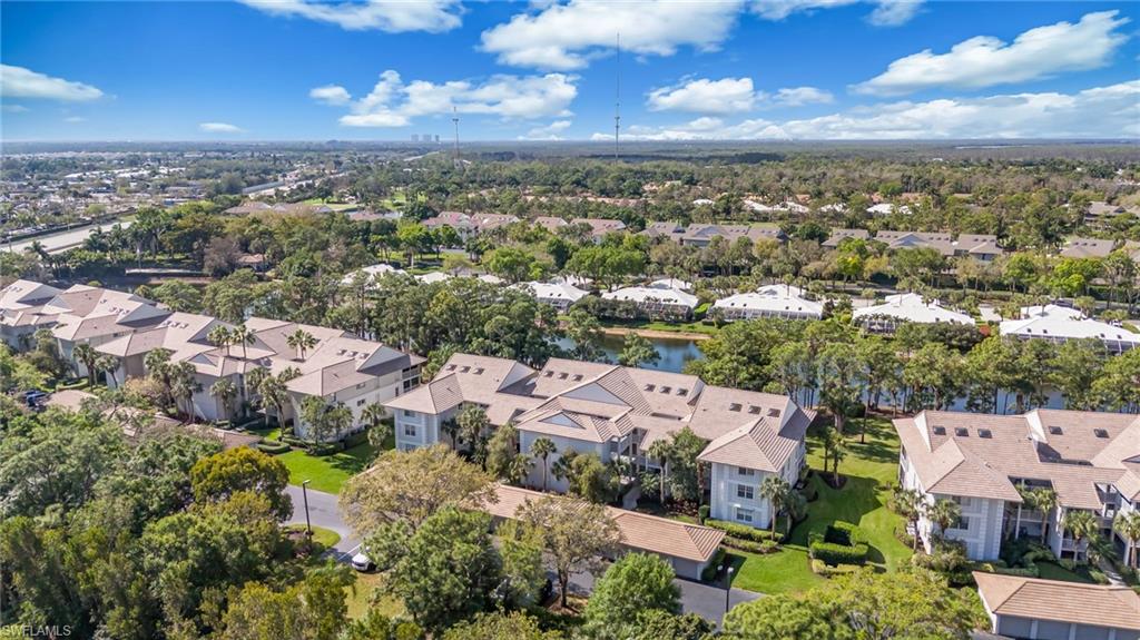 Aerial perspective of suburban area with a nearby body of water